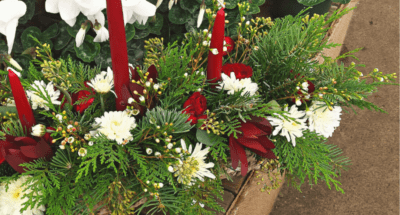 green red and white floral holiday centerpiece