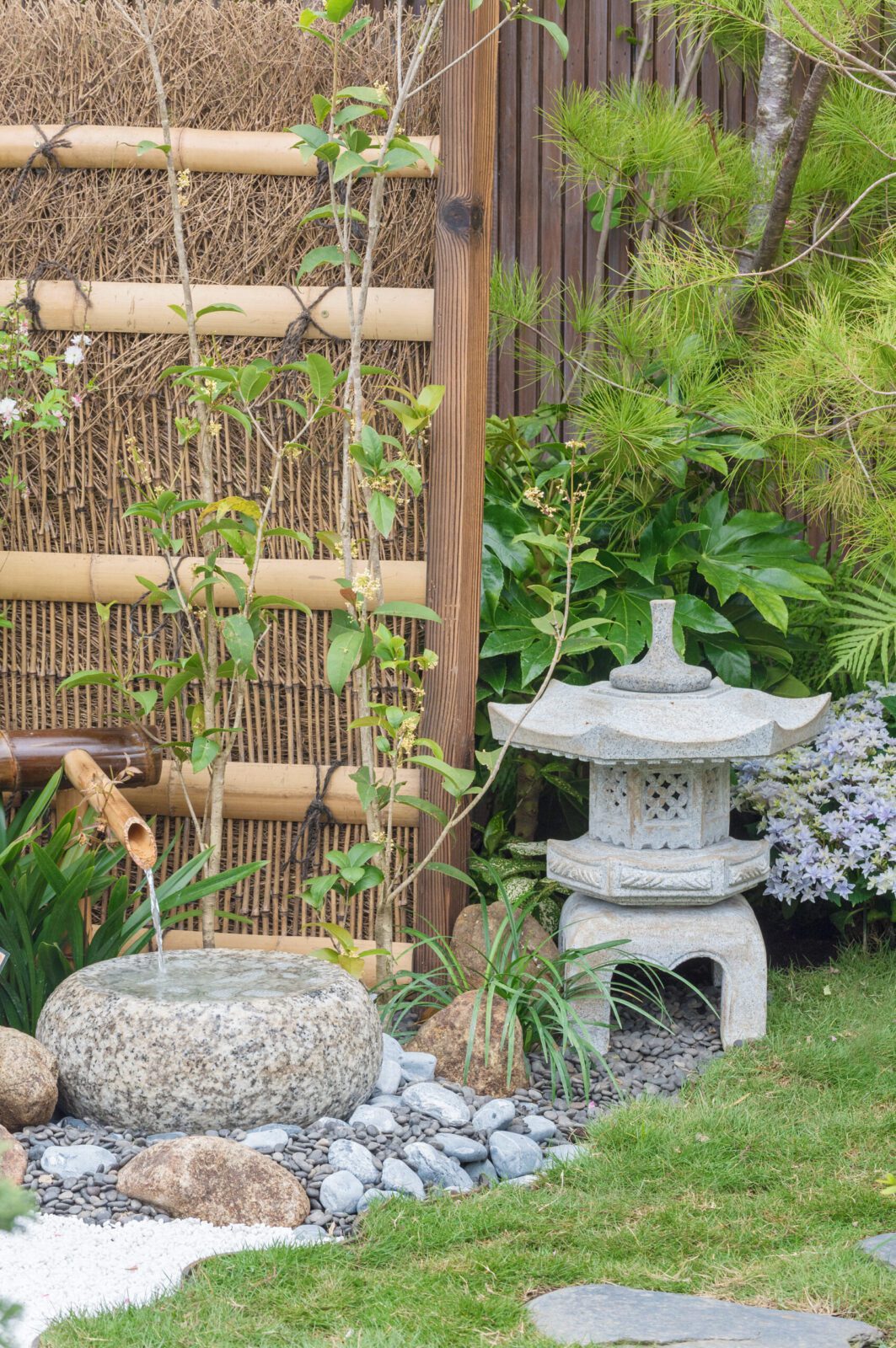 stone lantern and bamboo fountain in Japanese garden | City Floral Garden Center - Denver